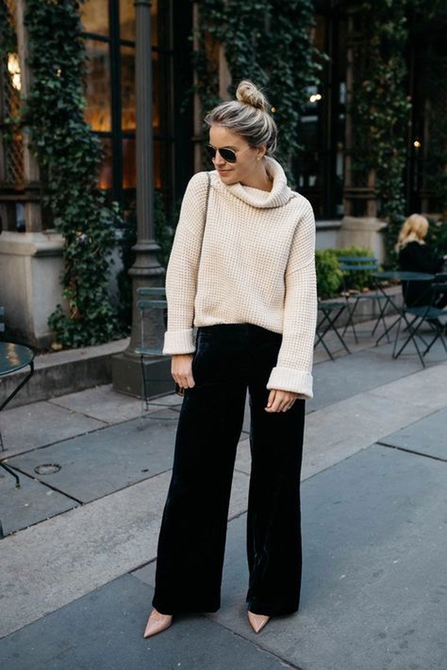 Black velvet wide-leg trousers with cream chunky knit sweater