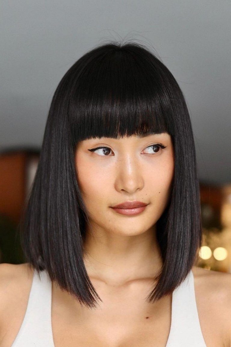 Jaw length bob with straight blunt bangs for a mod editorial look