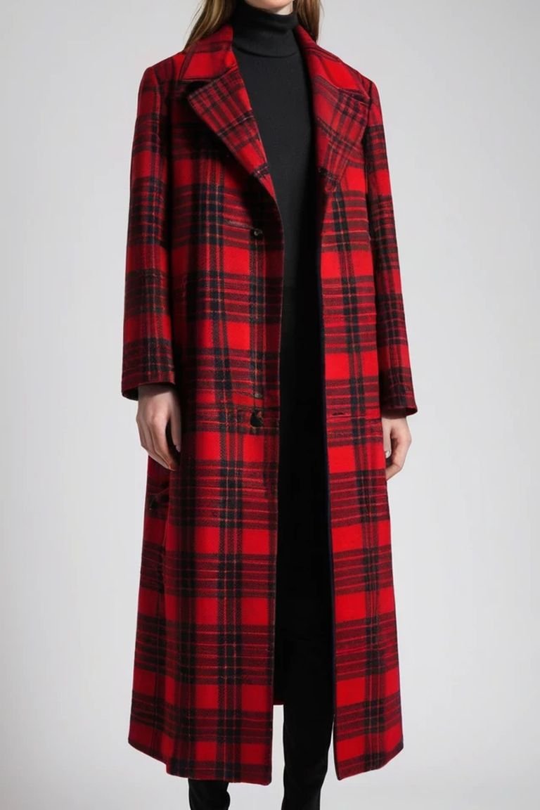 Red buffalo plaid coat over a black dress with boots, a holiday plaid winter outfit for women