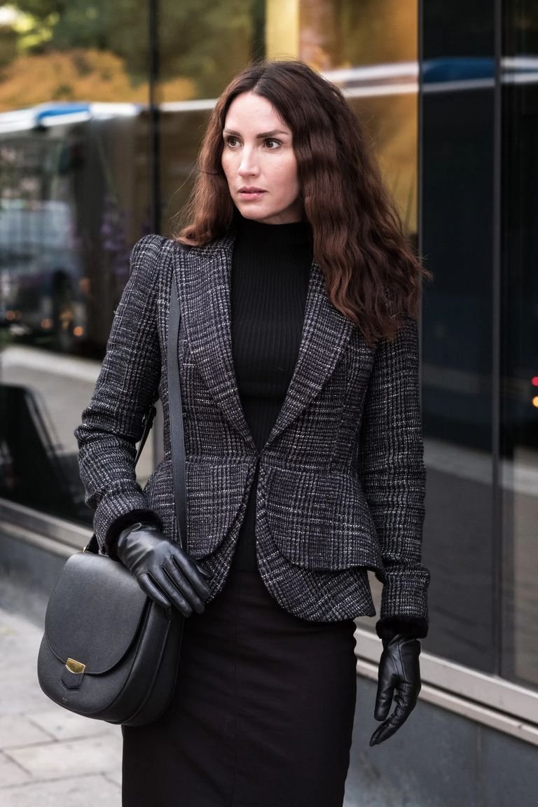 Grey plaid blazer with a black turtleneck and trousers, a professional plaid winter office outfit