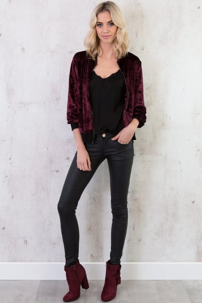 Crushed velvet bomber jacket with black cami and leather pants