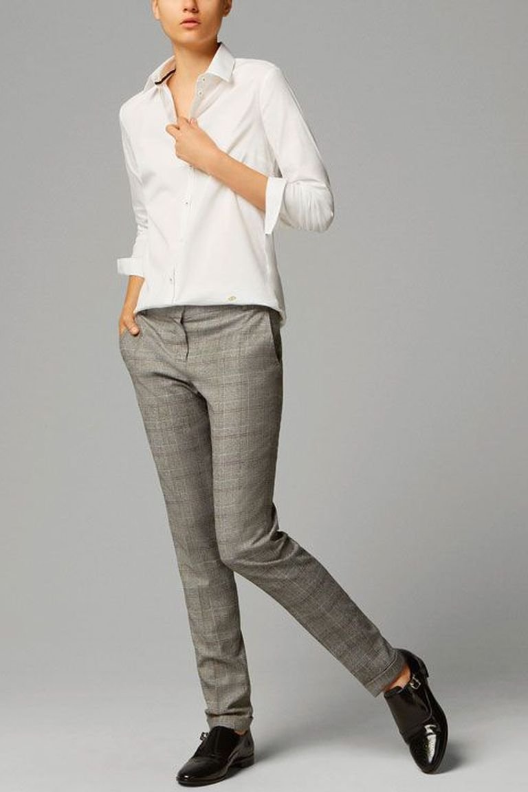 Plaid trousers with a white shirt and loafers, a crisp plaid winter outfit for travel days