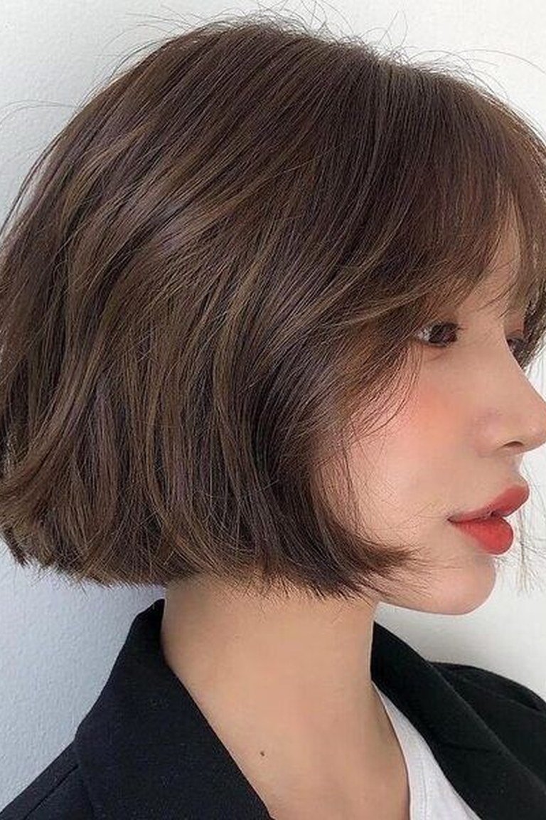 Soft layered jaw length bob with gentle face-framing to flatter a square jawline