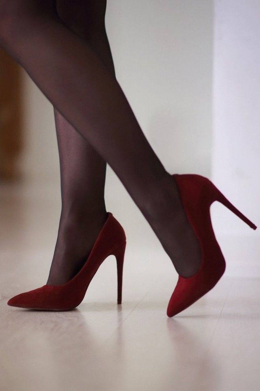 Ruby red velvet heels with sheer black tights