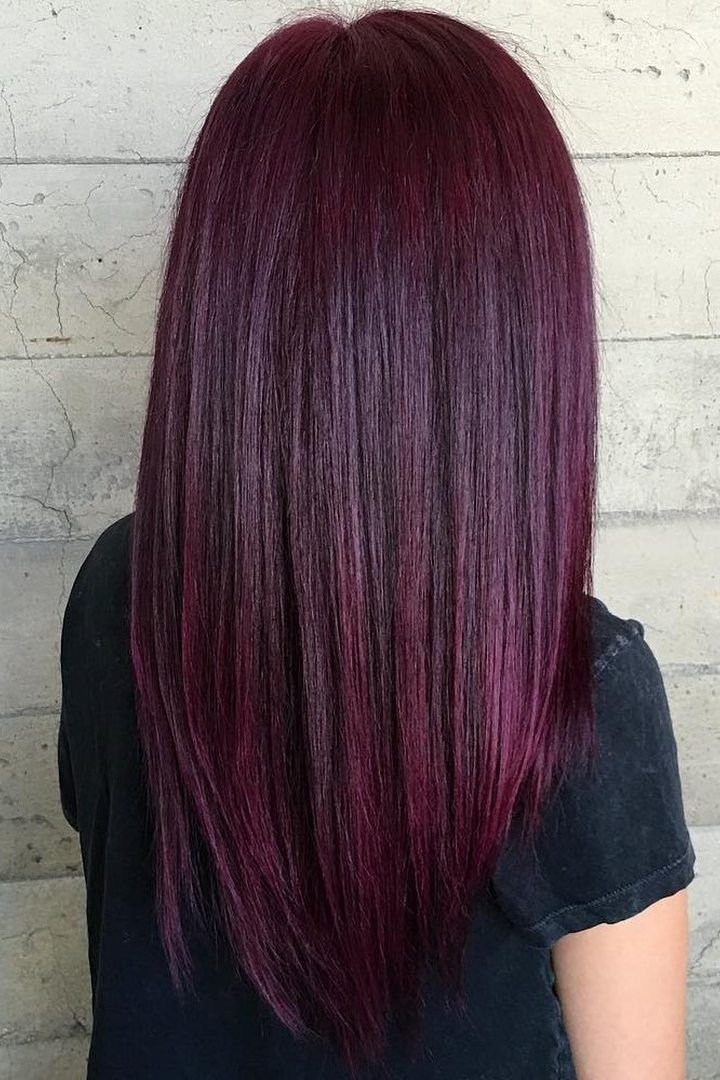Long sleek straight hair in classic deep burgundy colour