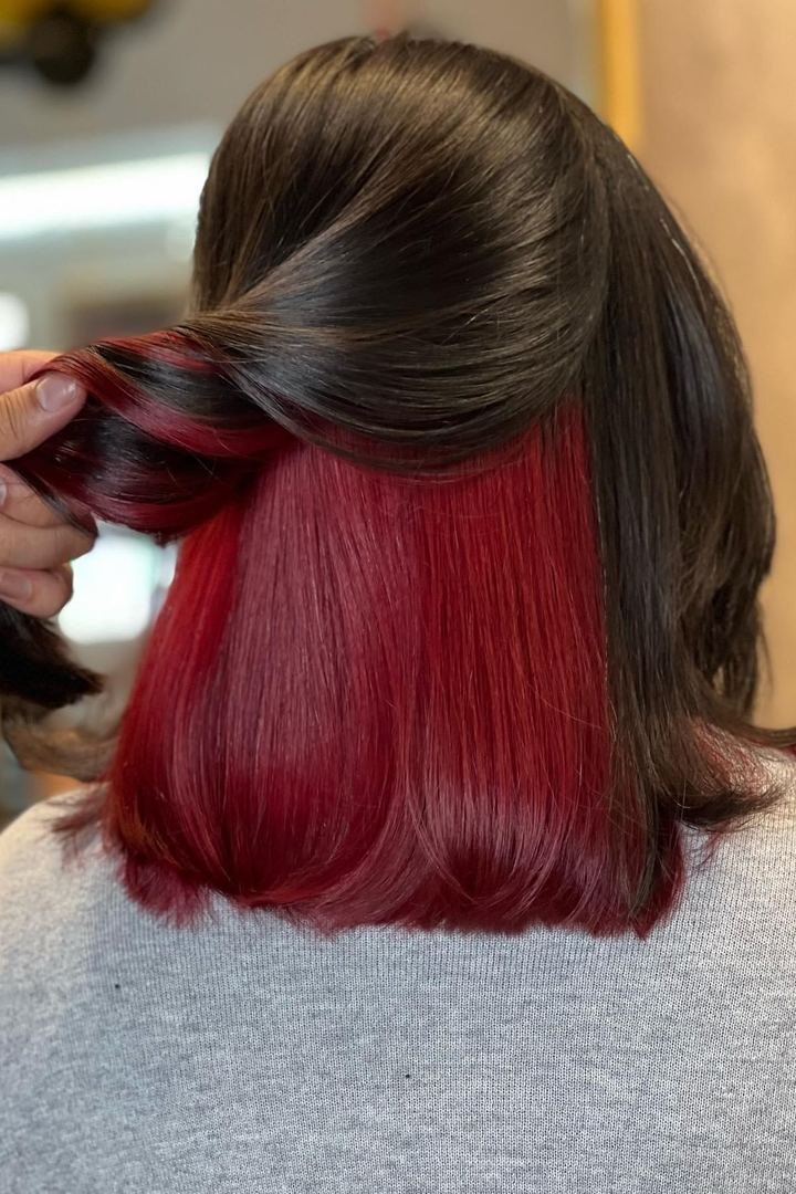 Back view of dark brown hair with a blunt dip-dye line, ends saturated in wine-red burgundy