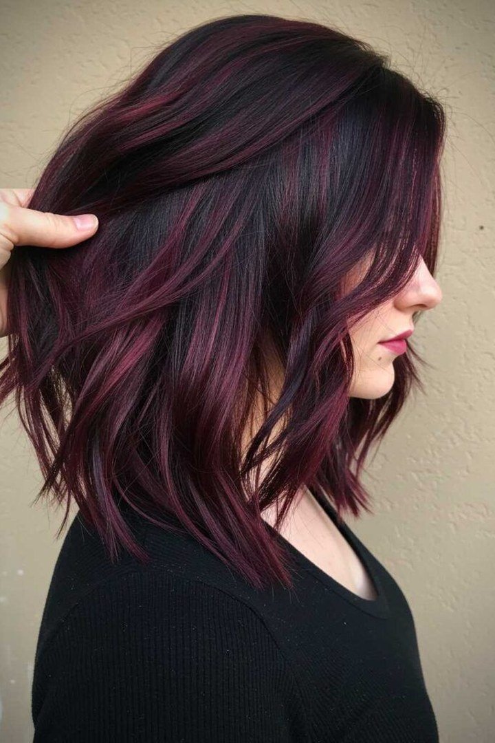 Dark black hair with subtle no-bleach burgundy wine tint