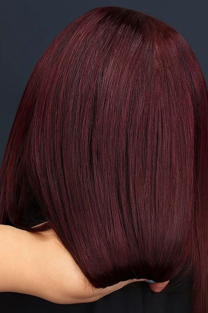 Ultra-sleek pin-straight glass burgundy hair with mirror shine