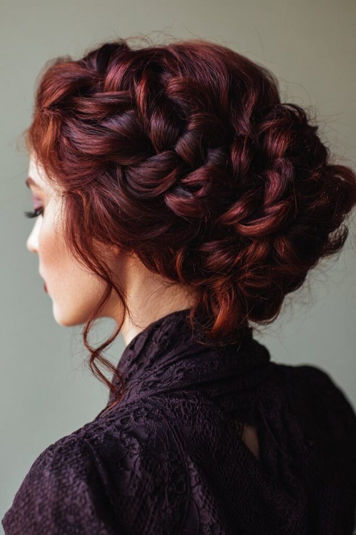 Elegant burgundy updo showing wine-red dimension in pinned twists