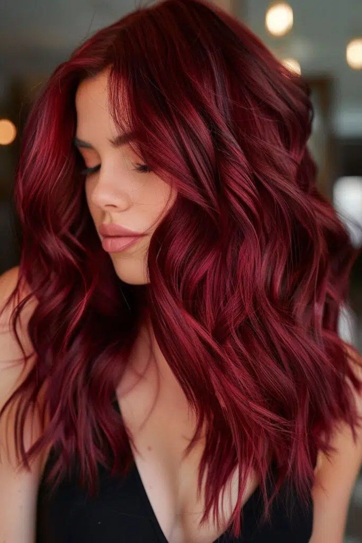 Front portrait of long wavy burgundy hair with rich fall dimension
