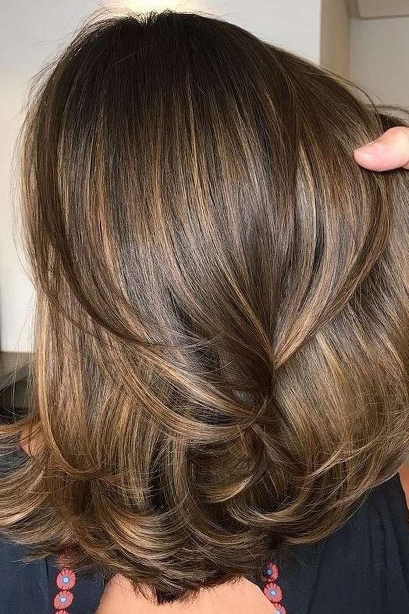 Close-up of internal layers creating volume in a brunette bob