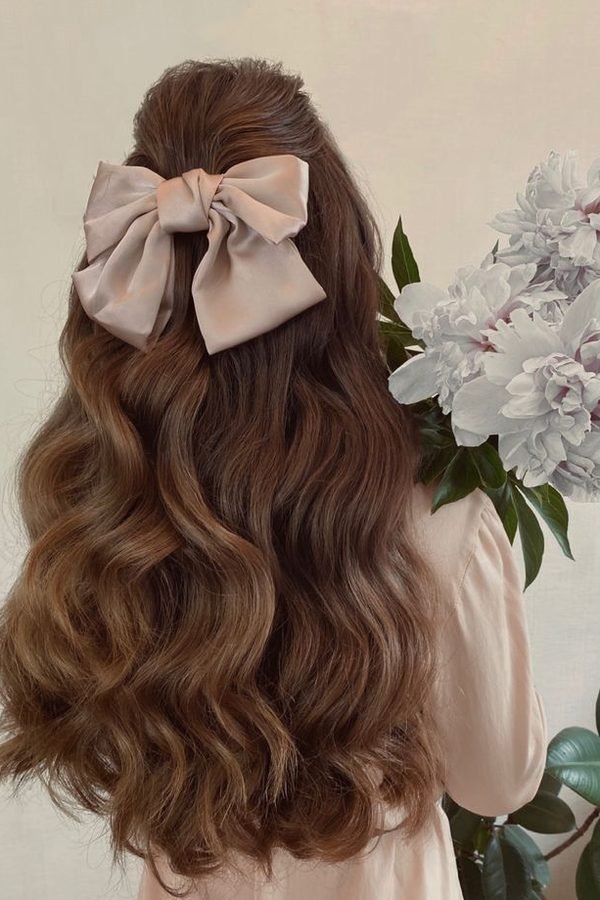 Beige linen bow on long romantic curls
