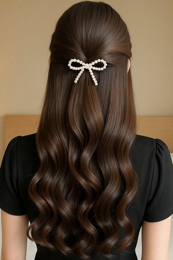 Pearl bow clip on glossy dark waves