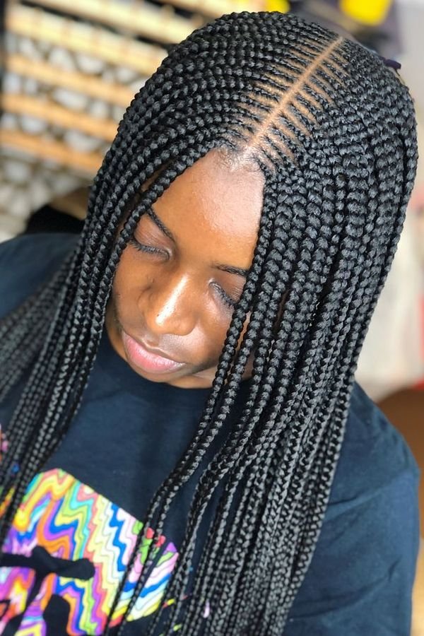 Small box braids worn long, neat fine parts seen from above