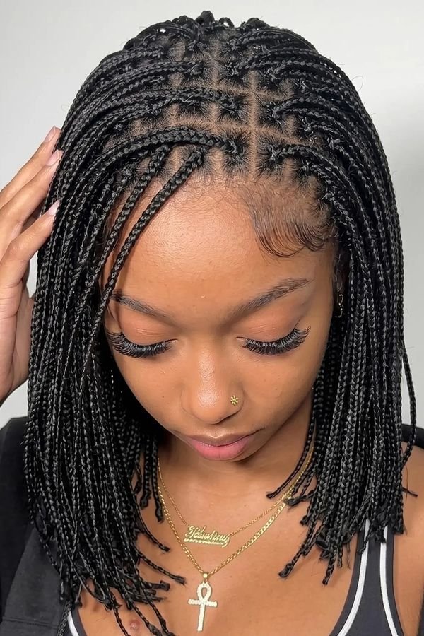 Shoulder-length box braids with a center part, seen from above