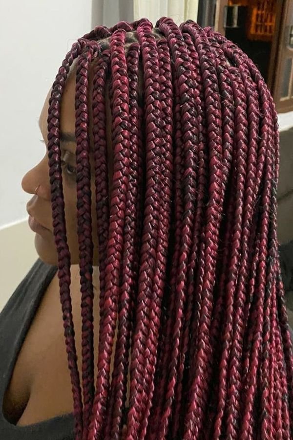 Burgundy box braids in profile, deep wine-red plaits