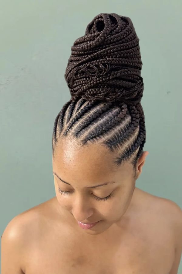 Box braids gathered into a sleek high bun, top view