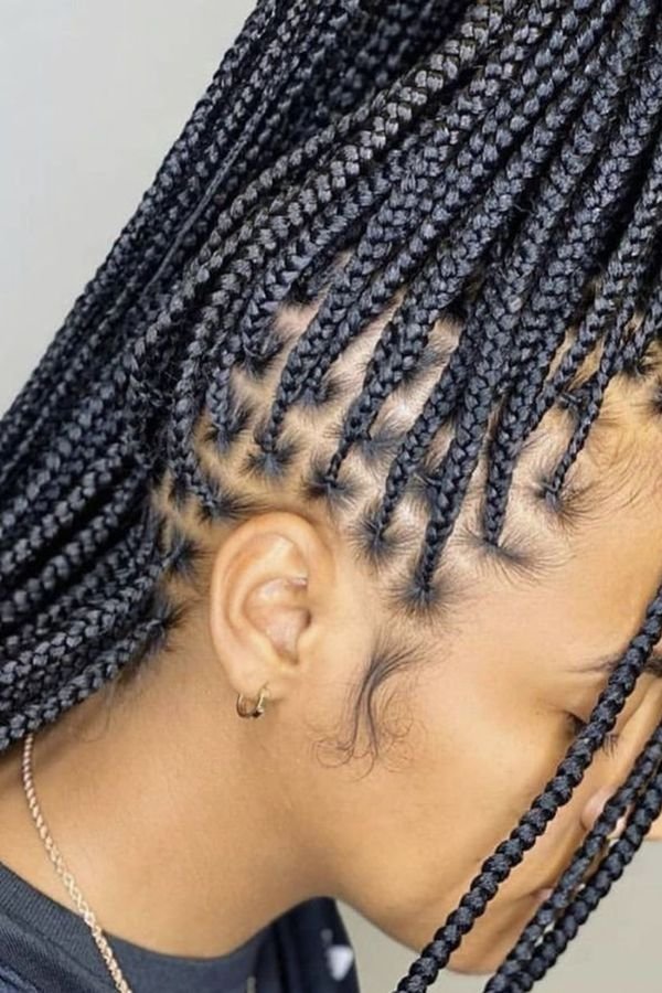 Face-framing box braids close-up showing front pieces left loose