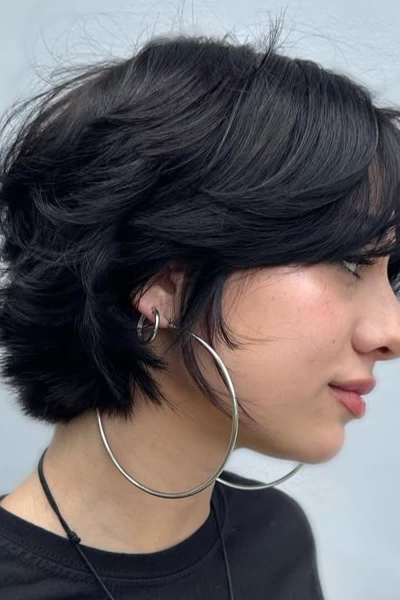 Short butterfly haircut with wispy chin-length layers