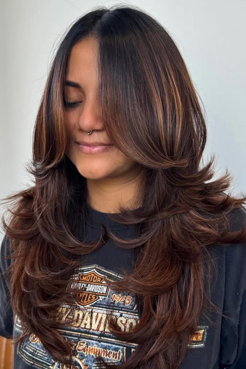 Butterfly haircut with multi-level front layers around the face
