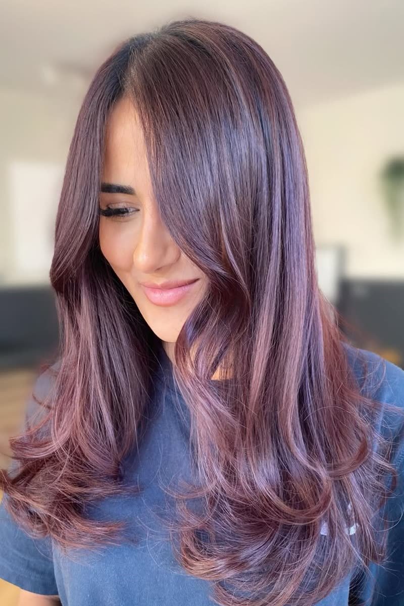 Warm auburn butterfly haircut with rich red-brown layers