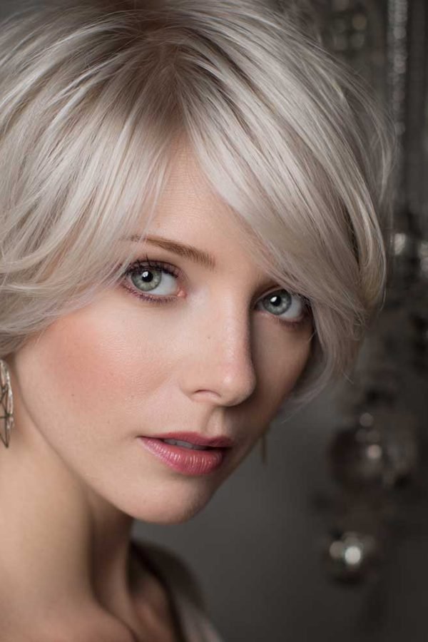 Platinum pixie bob with a side-swept fringe