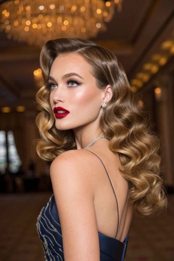 Retro Hollywood waves with a deep side part at a ballroom