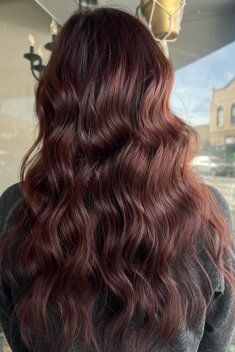 Classic cherry cola melt on long brunette waves