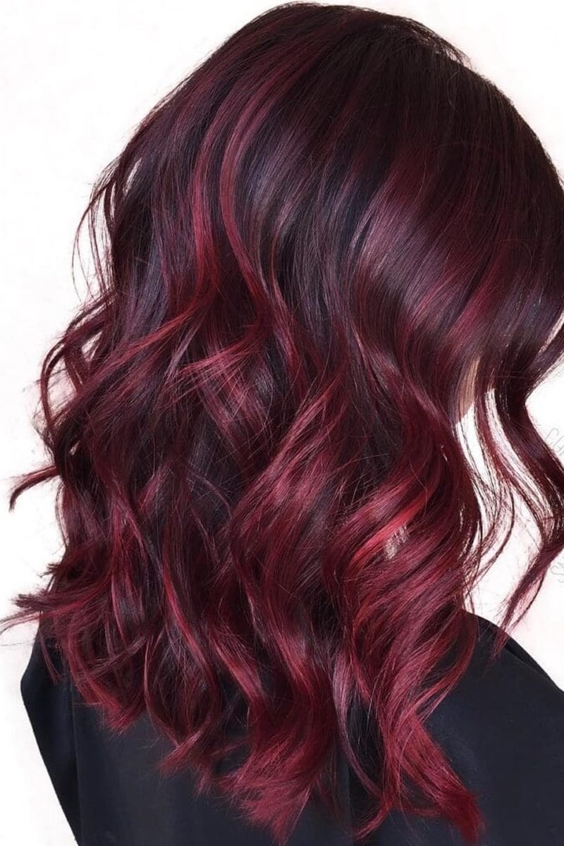 Cherry cola brunette on long layered hair