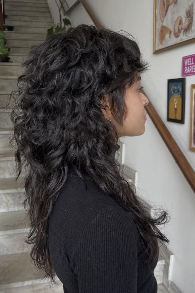 Long dark curly wolf cut, side and back view