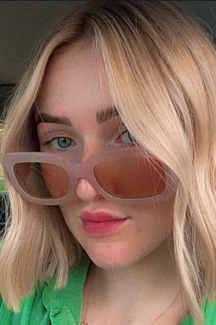 Chic french bob on woman wearing glasses