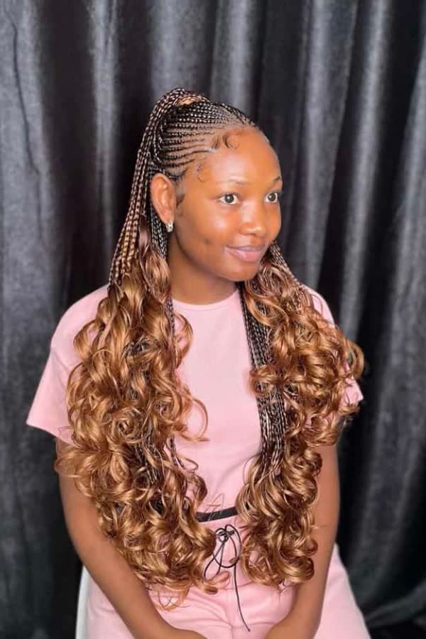 High ponytail updo of honey-brown ombre french curl braids