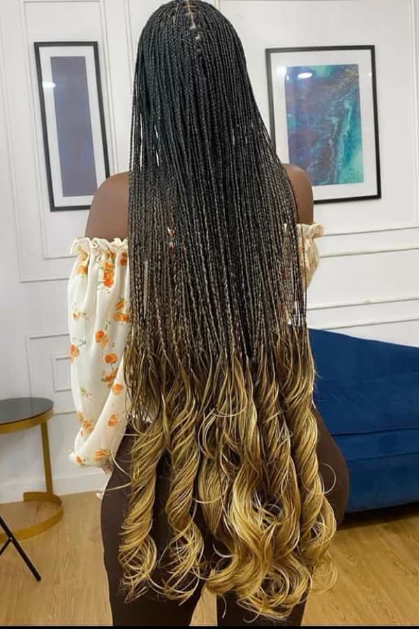 Back view of middle-part black-to-blonde ombre french curl braids