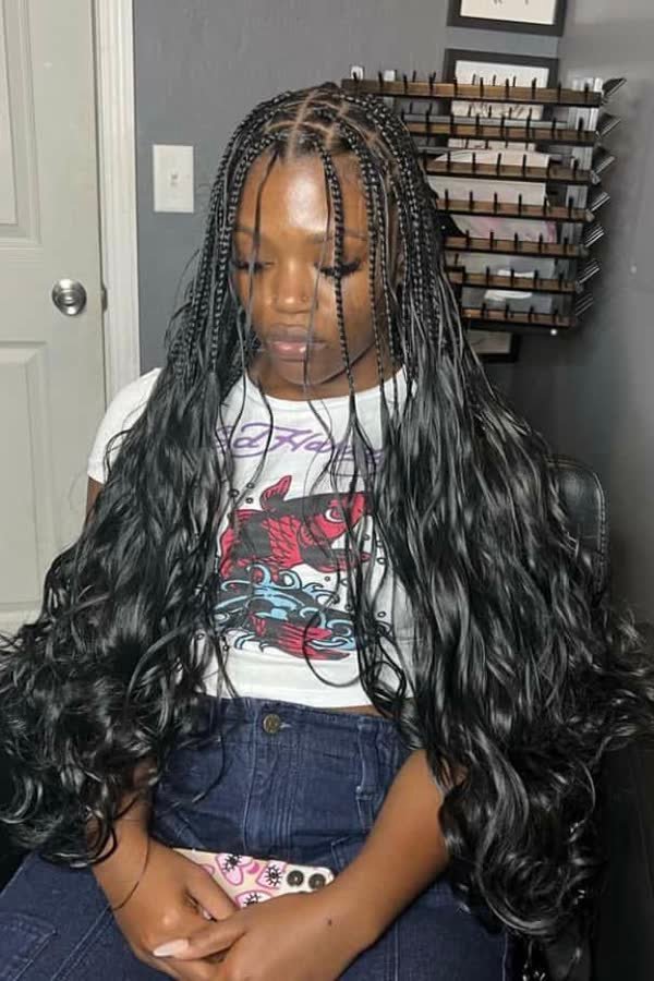Front view of extra-full dense black french curl braids with thick curly ends