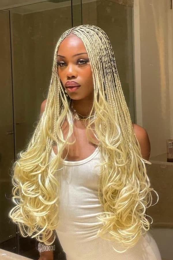 Front view of icy platinum blonde french curl braids with curly ends