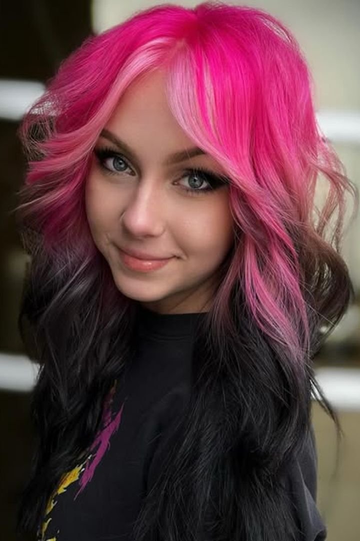 Dark hair with bold hot pink face-framing stripe panels, front view