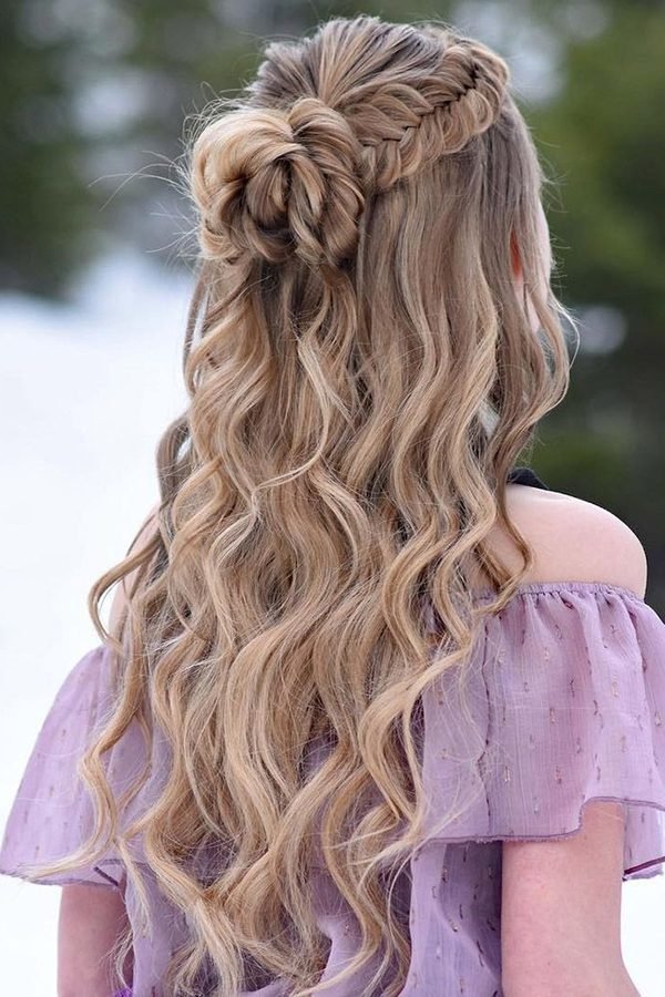 Woven braided knot half-up hairstyle with long loose waves, back view