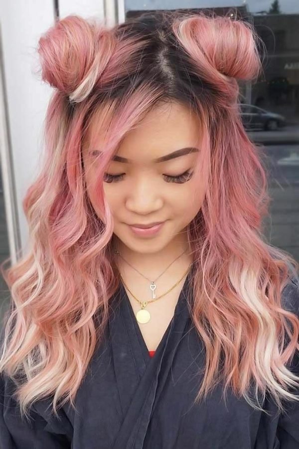 Half-up space buns with pink wavy lengths, front view