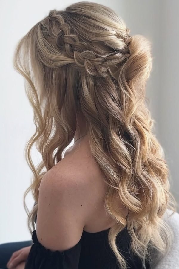 Boho braided crown half-up hairstyle with long waves, back view
