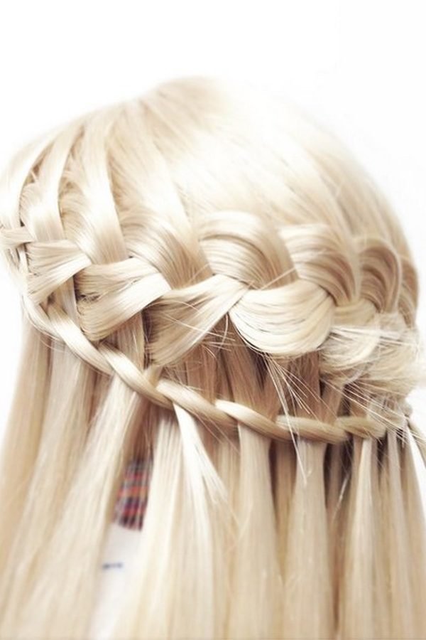 Waterfall braid half-up hairstyle on platinum blonde hair, close-up
