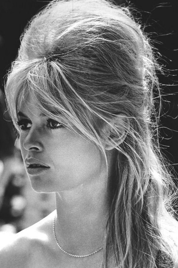 1960s Bardot half-up hairstyle with a backcombed beehive crown, black and white photo