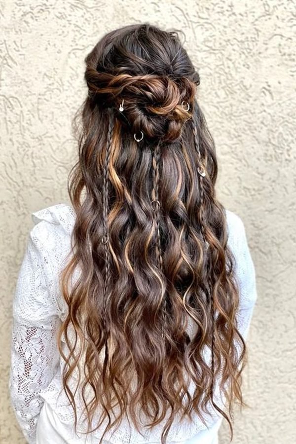 Boho knotted half-up hairstyle with long crimped waves and gold ring details, back view