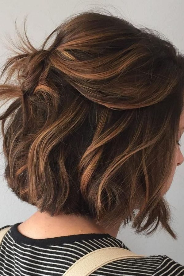 Mini half-up twist on a short wavy lob, side back view