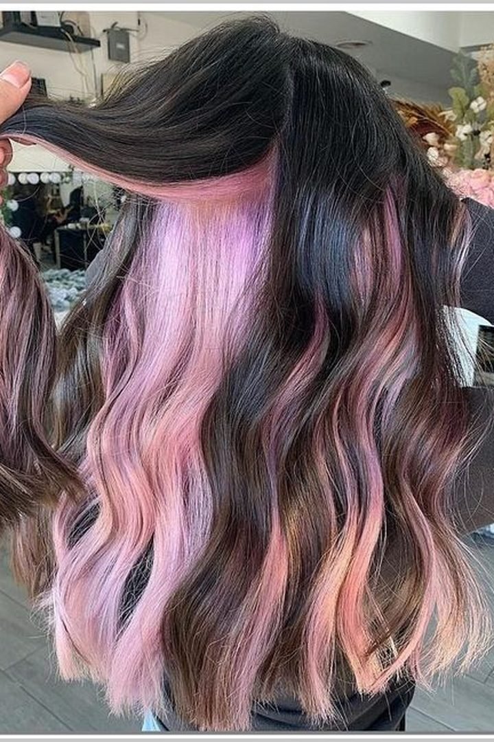 Black hair with dark pink peekaboo underlayer revealed, back view