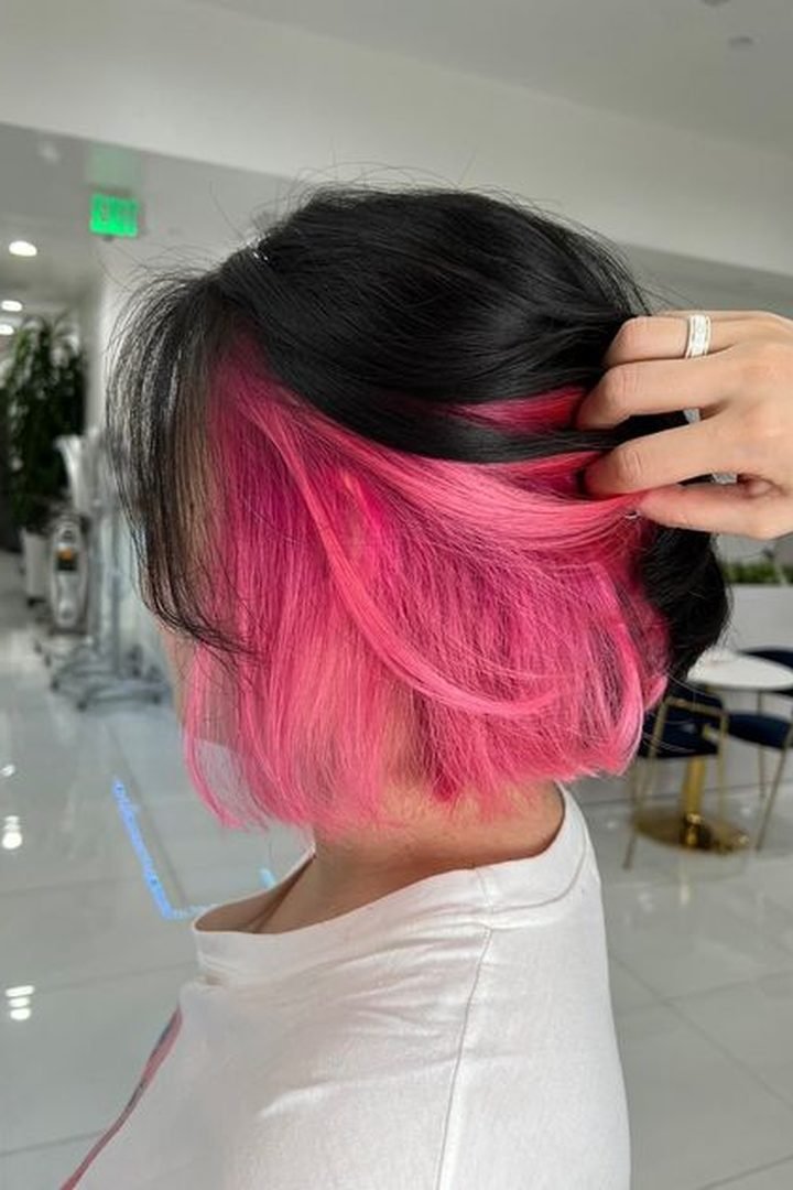 Cherry pink peekaboo underlayer on dark bob, back reveal