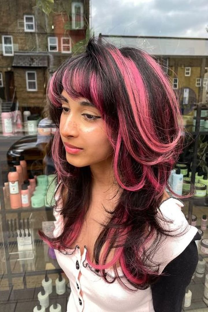Hot pink stripe paired with curtain bangs