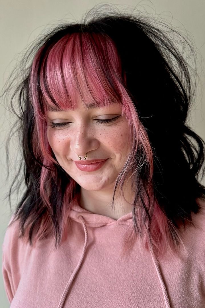 Split-dye style with pink front panels and strong contrast