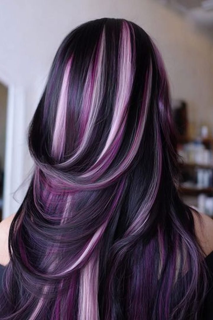 Violet pink peekaboo streaks on long dark hair, back view