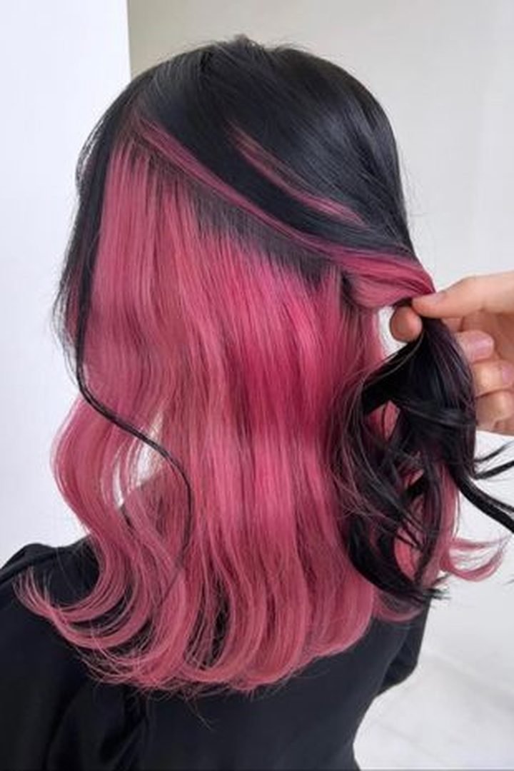 Hidden dark pink back panel revealed by lifting hair