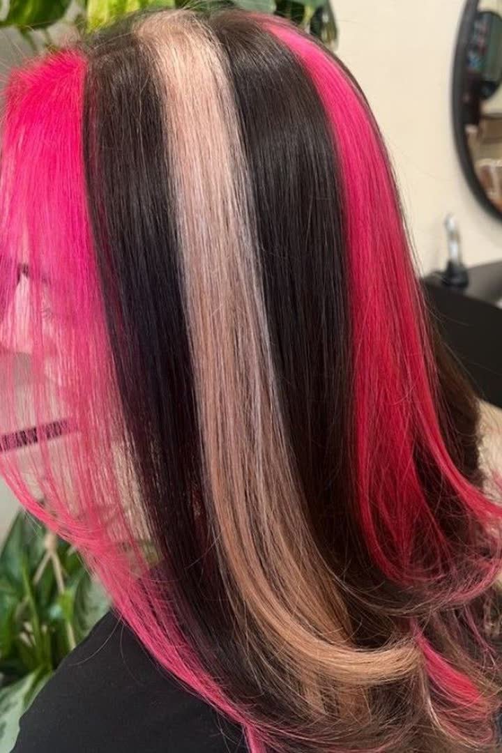 Symmetrical double pink stripes on both sides of the face